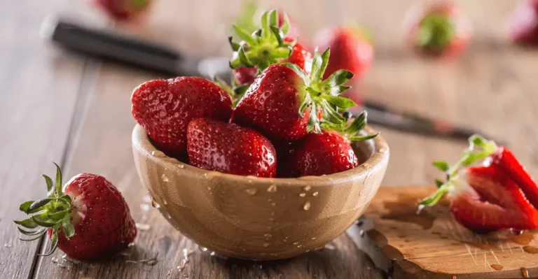 Fresh strawberries in a bowl on the kitchen counter