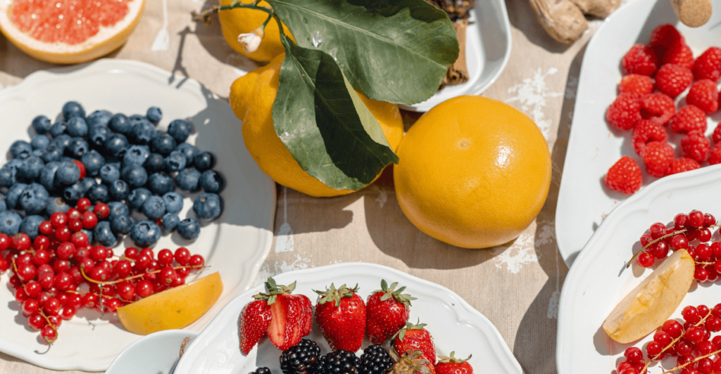 Fresh summer superfoods like watermelon, strawberries, tomatoes and peppers on a table